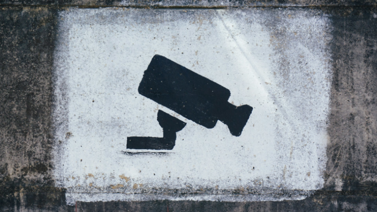 Spray painted security camera UNSPLASH
